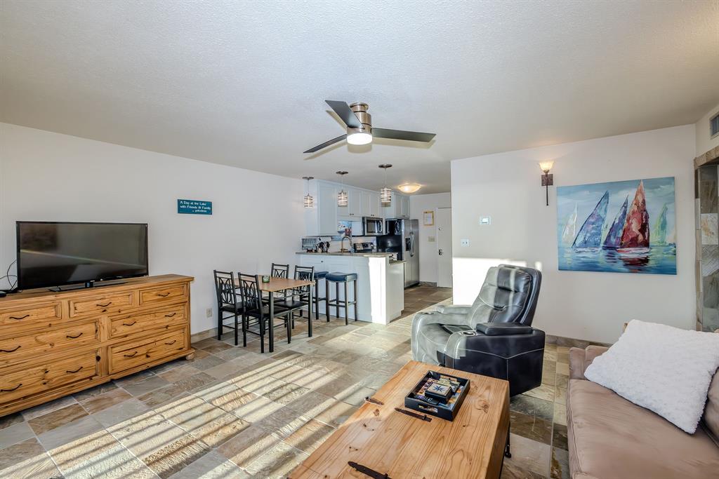 1655 Cedar Crest Loop, Unit E7 Graford, TX 76449 - Photo 13 of 35 a living room with furniture and wooden floor