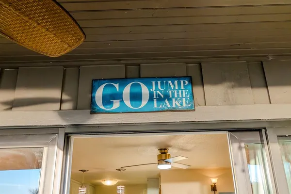 a dining room with furniture and a mirror