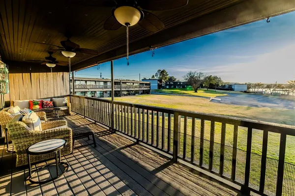a view of a balcony with chairs