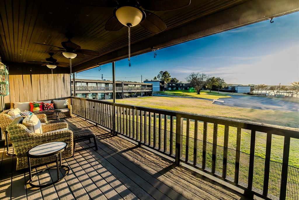 1655 Cedar Crest Loop, Unit E7 Graford, TX 76449 - Photo 3 of 35 a view of a balcony with chairs