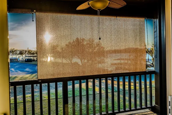 a view of a balcony with furniture