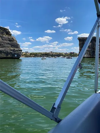 a kitchen with a sink a stove and furniture