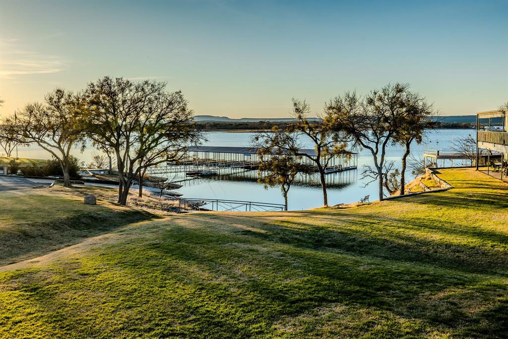 1655 Cedar Crest Loop, Unit E7 Graford, TX 76449 - Photo 4 of 35 a view of a swimming pool with an ocean view