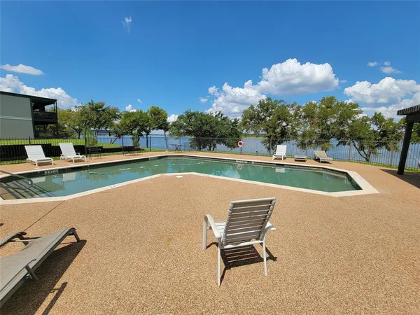 a view of a swimming pool with a lounge chair