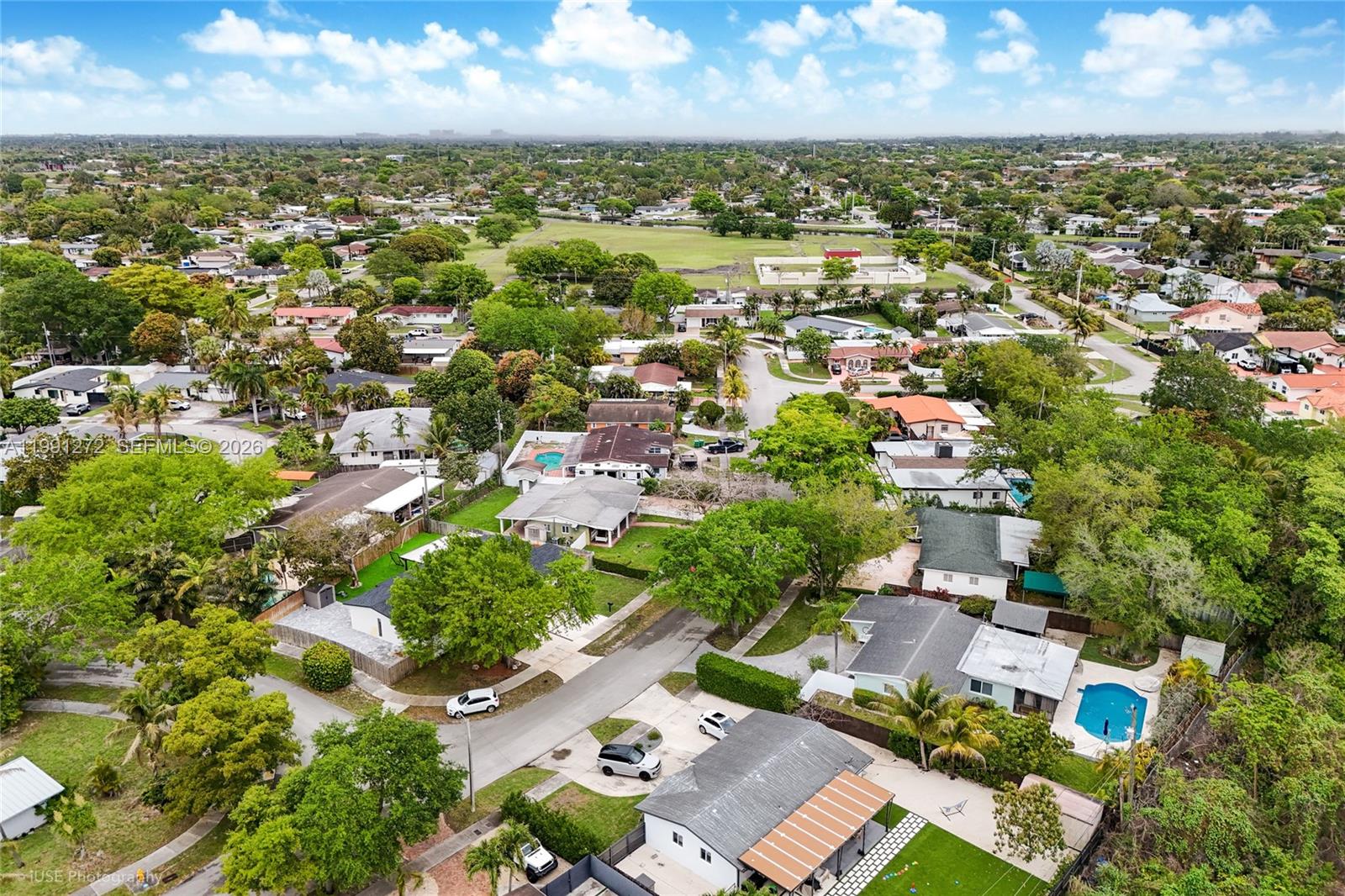 8535 Southwest 97th Road Miami, FL 33173 - Photo 25 of 28 an aerial view of a city with lots of residential buildings and mountain view in back