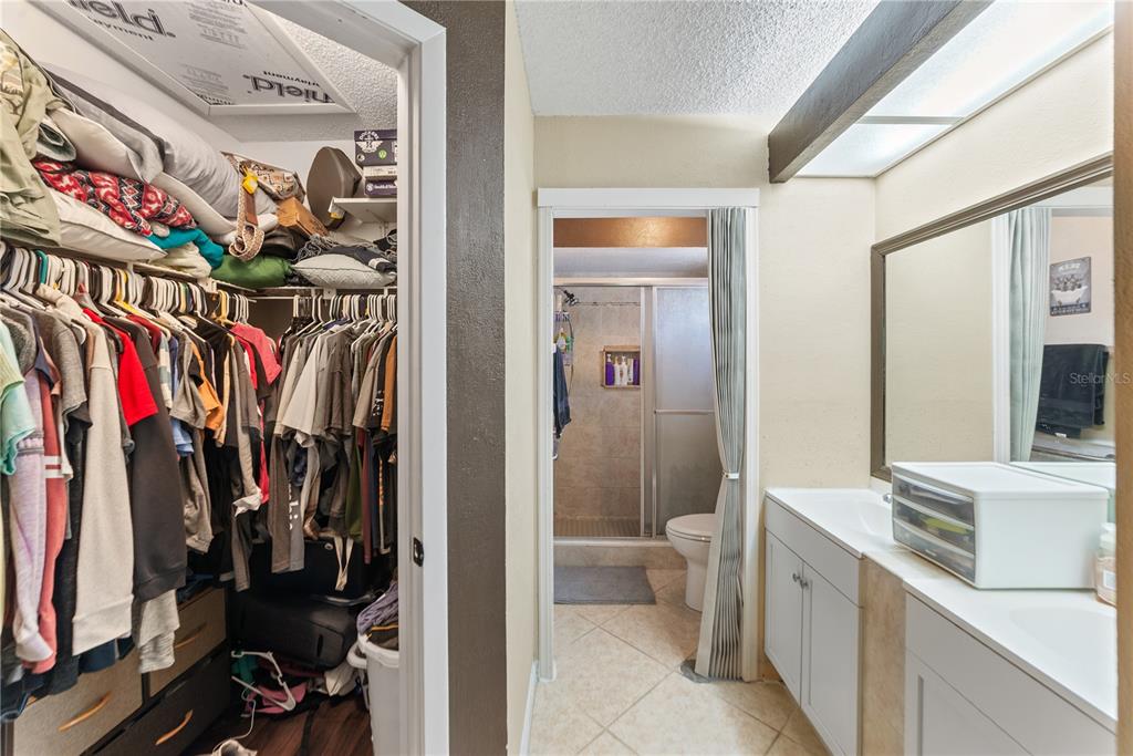 8715 Huntsman Lane Port Richey, FL 34668 - Photo 27 of 54 a view of walk in closet with clothes