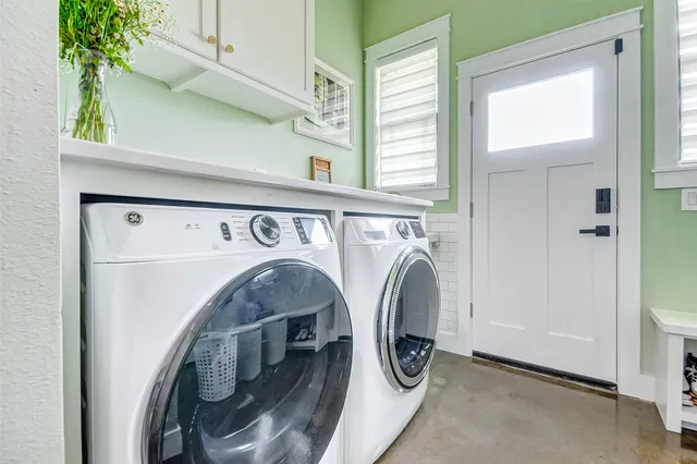 a utility room with dryer and washer