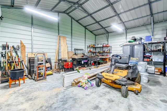 a view of a chairs and table in backyard of the house