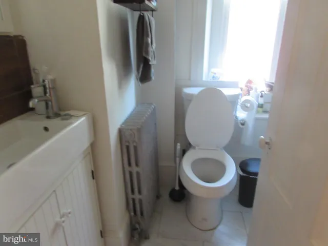 a bathroom with a toilet and a sink