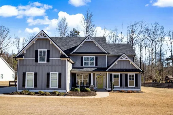 front view of a house with a yard