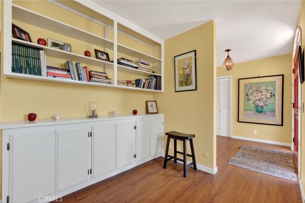 10079 West Lilac Road Escondido, CA 92026 - Photo 12 of 50 a view of a bedroom with wooden floor and cabinet