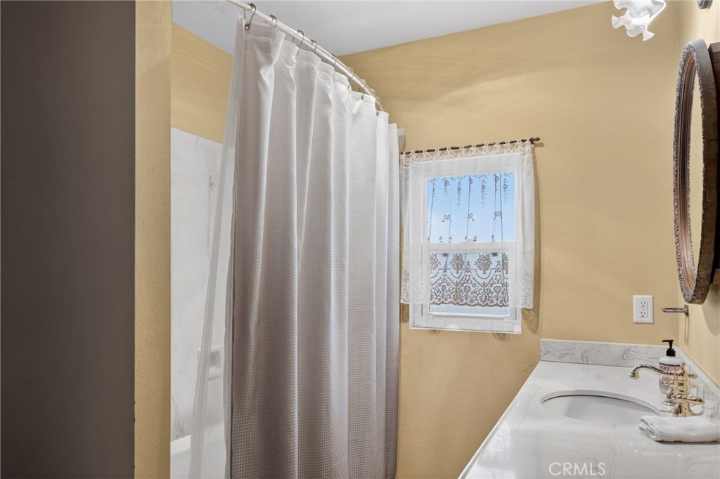 10079 West Lilac Road Escondido, CA 92026 - Photo 15 of 50 a bathroom with a tub and shower