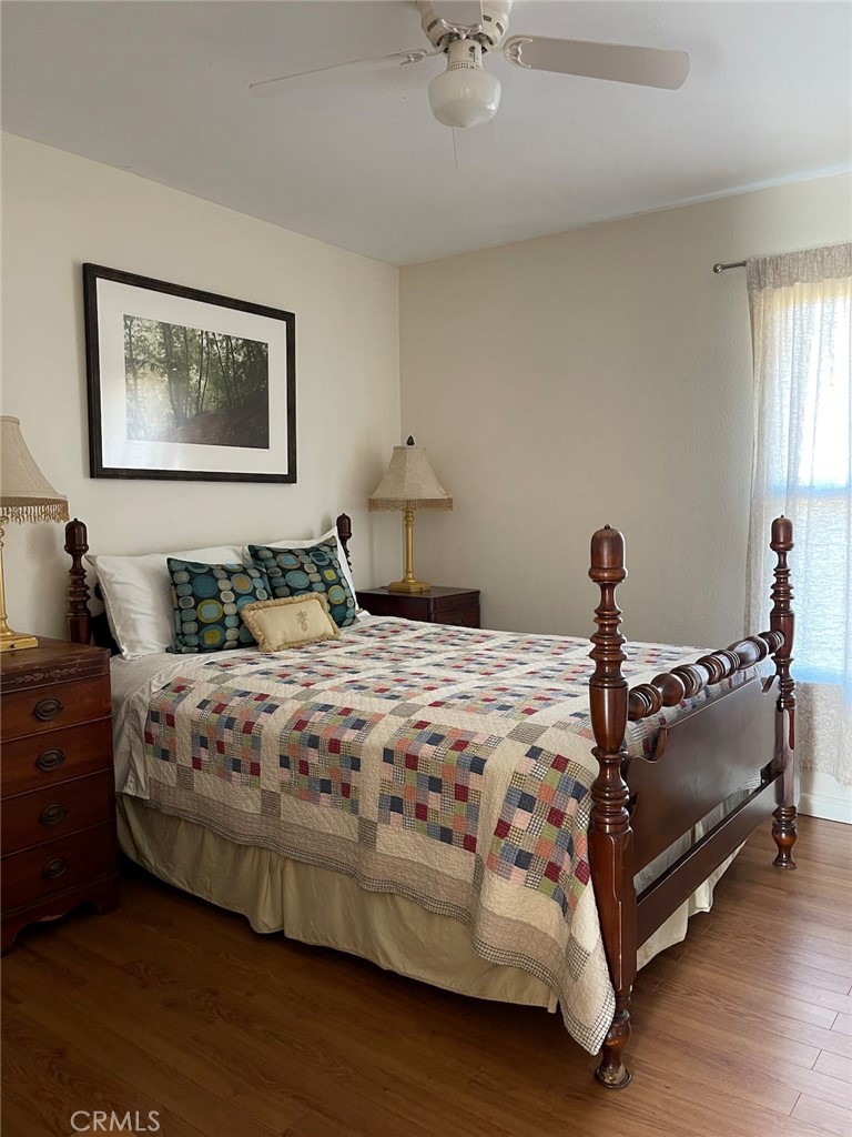 10079 West Lilac Road Escondido, CA 92026 - Photo 17 of 50 a bedroom with a bed and lamp