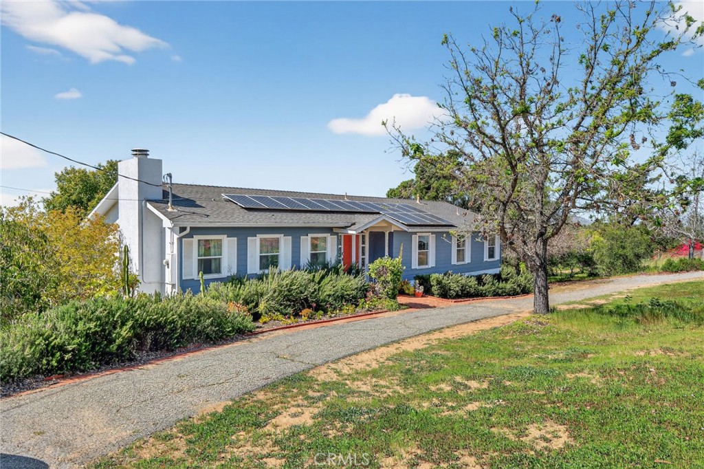 10079 West Lilac Road Escondido, CA 92026 - Photo 2 of 50 a front view of a house with a yard