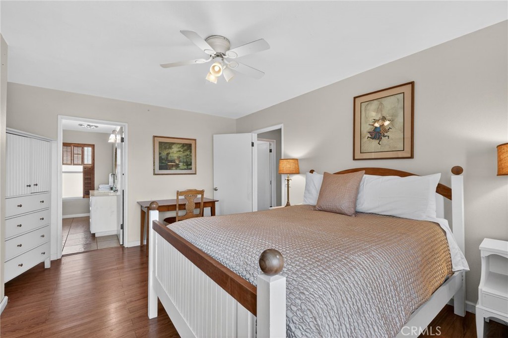 10079 West Lilac Road Escondido, CA 92026 - Photo 23 of 50 a bedroom with a bed and a chandelier