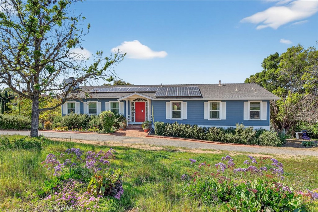 10079 West Lilac Road Escondido, CA 92026 - Photo 3 of 50 a front view of a house with a yard