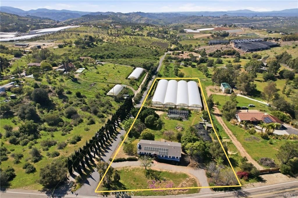 10079 West Lilac Road Escondido, CA 92026 - Photo 33 of 50 an aerial view of residential houses with outdoor space and parking