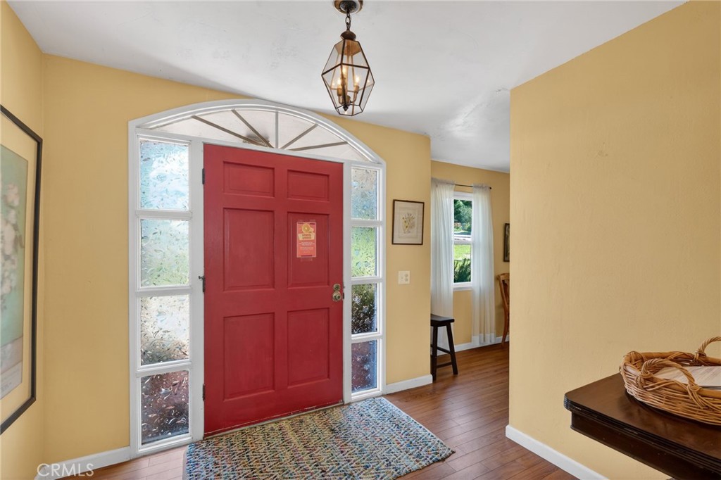 10079 West Lilac Road Escondido, CA 92026 - Photo 7 of 50 a view of a hallway with wooden floor and closet