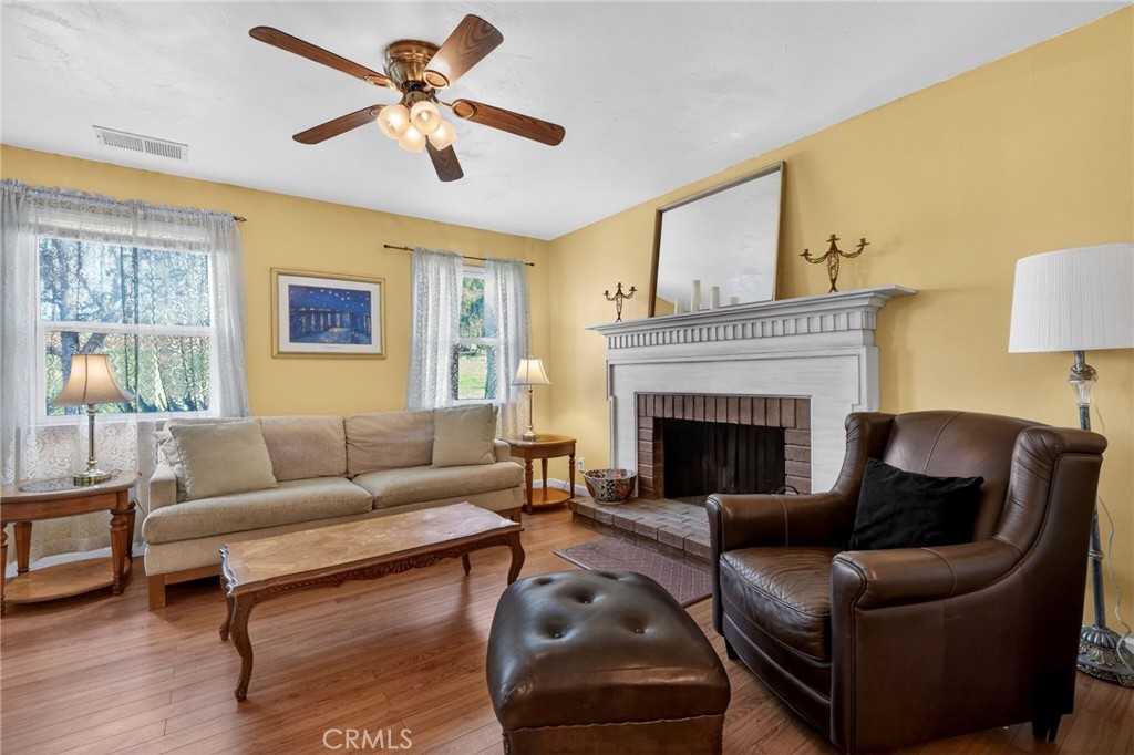 10079 West Lilac Road Escondido, CA 92026 - Photo 8 of 50 a living room with furniture and a fireplace