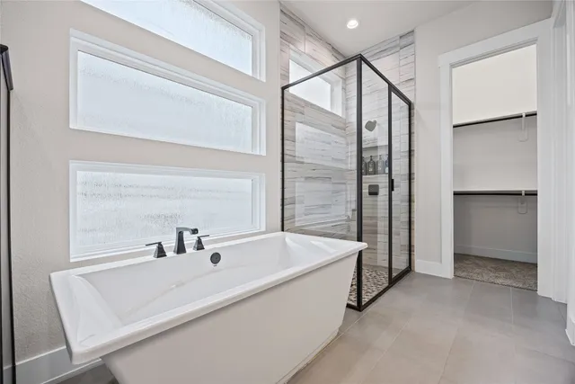 a bathroom with a tub and a sink