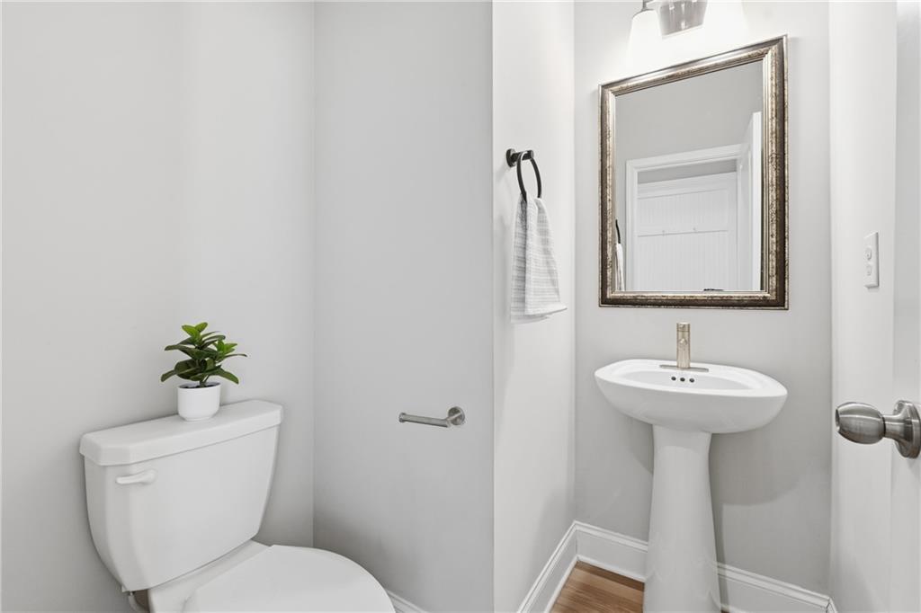 4183 Valtek Court Suwanee, GA 30024 - Photo 19 of 46 a bathroom with a toilet sink and mirror