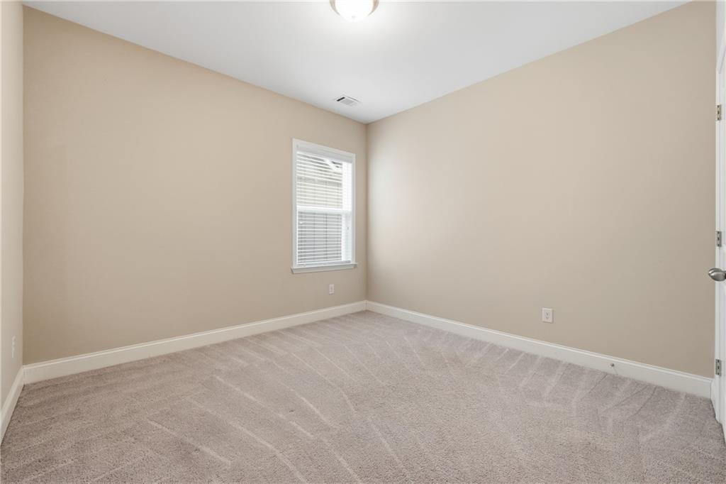 4183 Valtek Court Suwanee, GA 30024 - Photo 22 of 46 an empty room with windows and closet