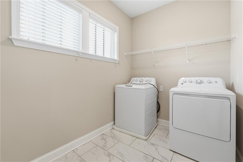 4183 Valtek Court Suwanee, GA 30024 - Photo 37 of 46 a utility room with dryer and washer