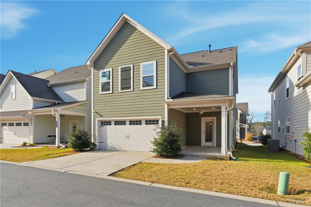 4183 Valtek Court Suwanee, GA 30024 - Photo 39 of 46 a view of a house with a patio and a yard