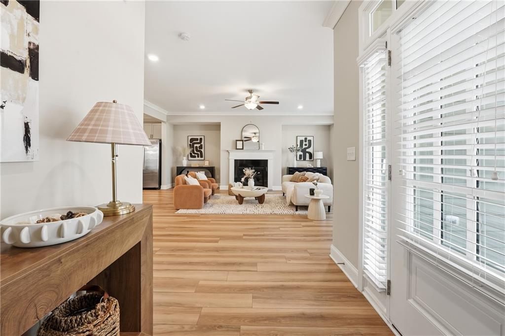 4183 Valtek Court Suwanee, GA 30024 - Photo 5 of 46 a living room with furniture fireplace and a large window