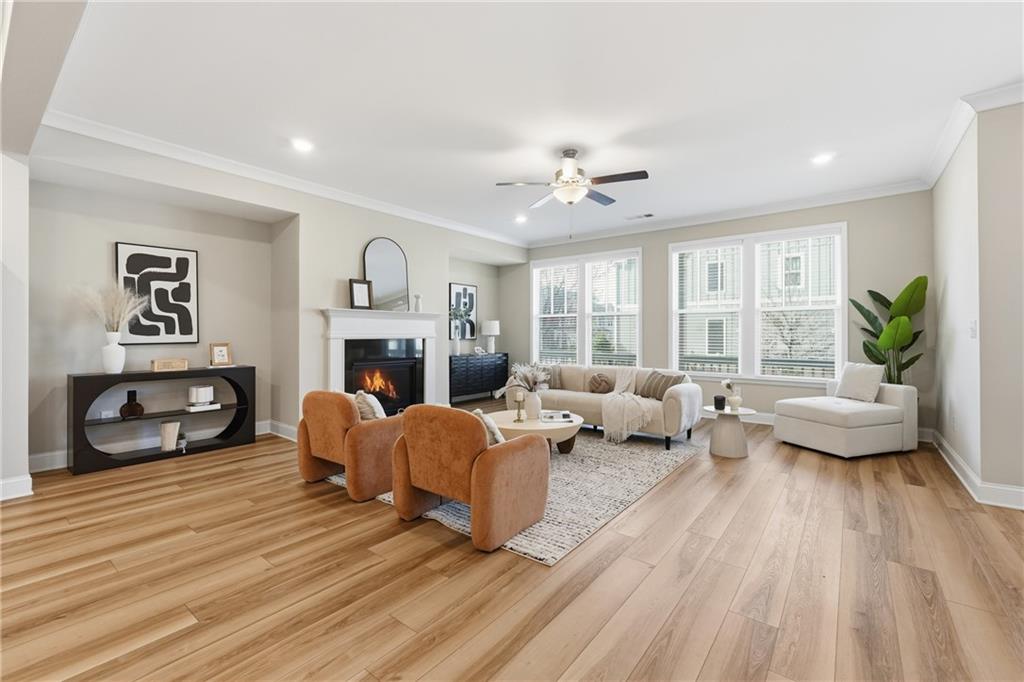 4183 Valtek Court Suwanee, GA 30024 - Photo 6 of 46 a living room with furniture and a fireplace