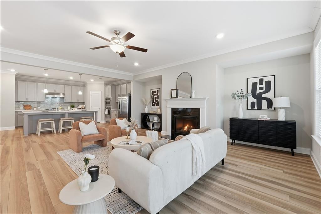 4183 Valtek Court Suwanee, GA 30024 - Photo 9 of 46 a living room with furniture fireplace and window
