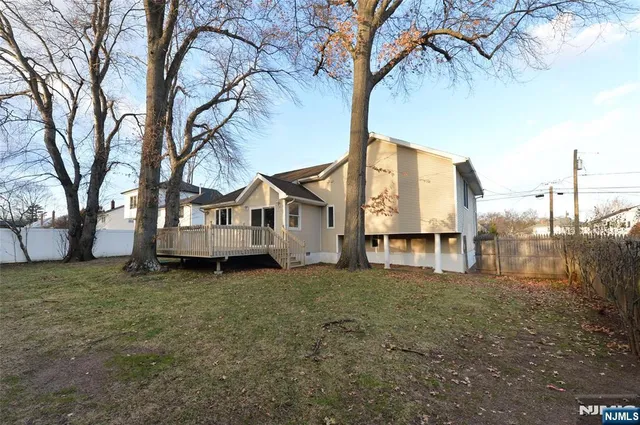 a house that has a tree in front of it