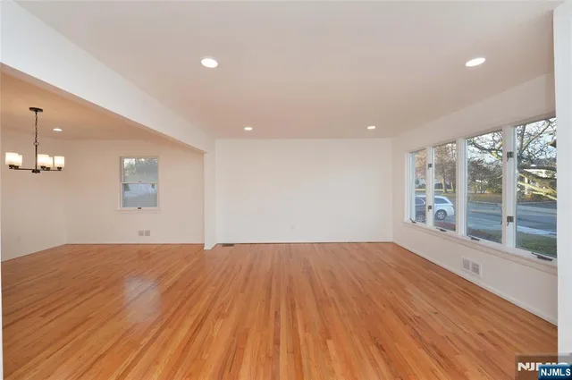a view of an empty room with glass door