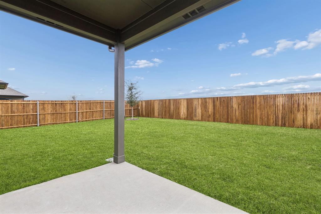 2303 Wind River Road Princeton, TX 75407 - Photo 28 of 32 Covered Patio in the Winters home plan by Trophy Signature Homes – REPRESENTATIVE PHOTO