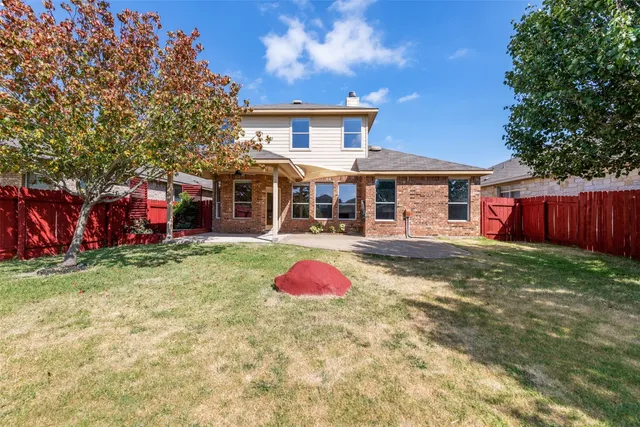 a front view of a house with yard