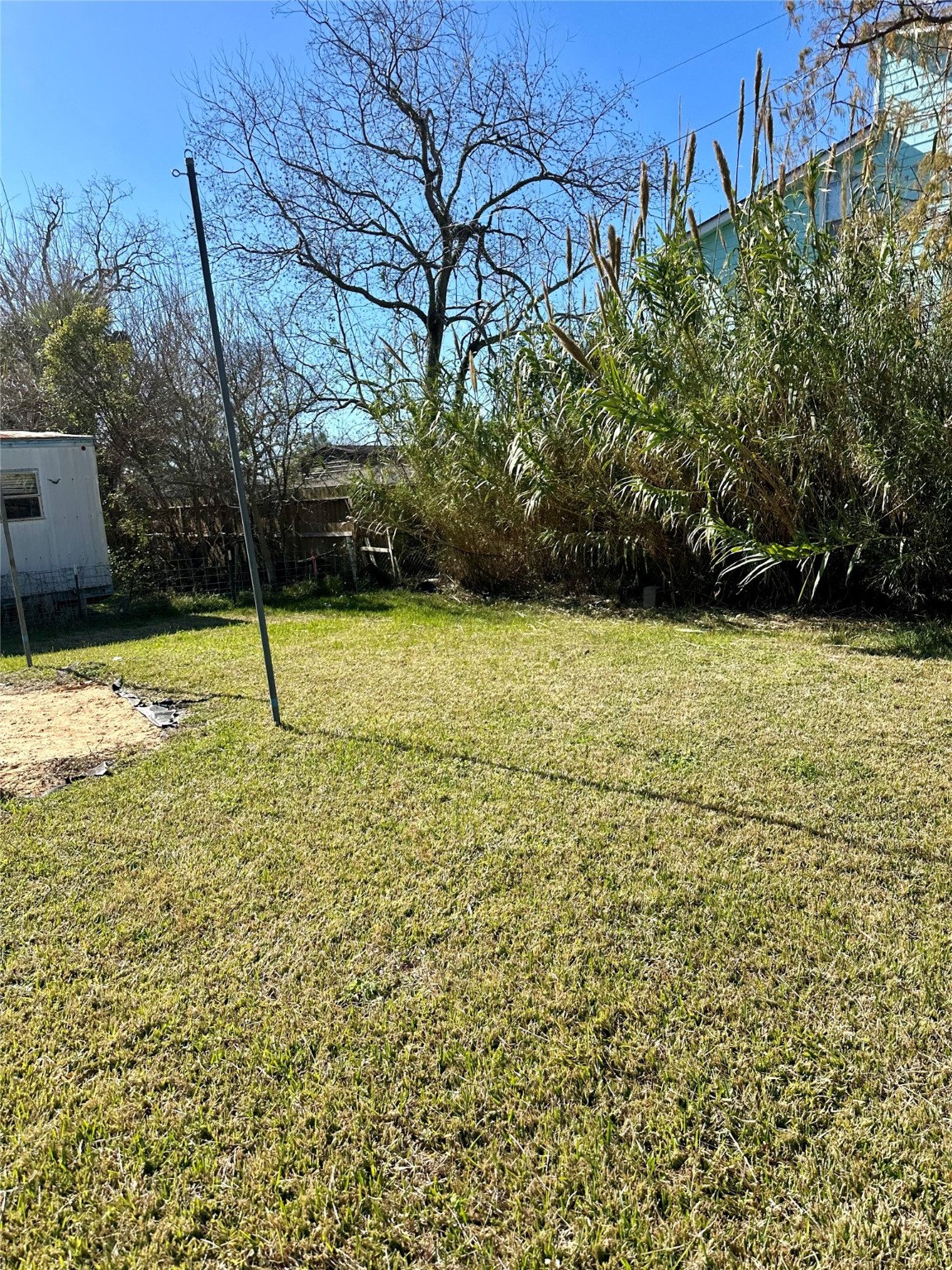 124 7th Street Dickinson, TX 77539 - Photo 15 of 19 a view of a yard with basketball court
