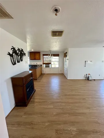 a kitchen with stainless steel appliances a refrigerator and a stove top oven