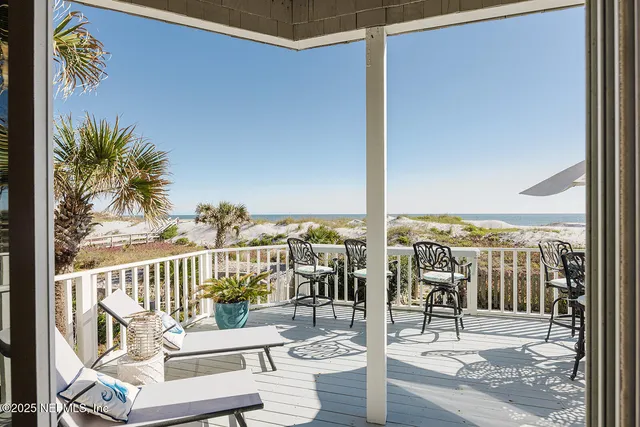 a view of a balcony with chairs