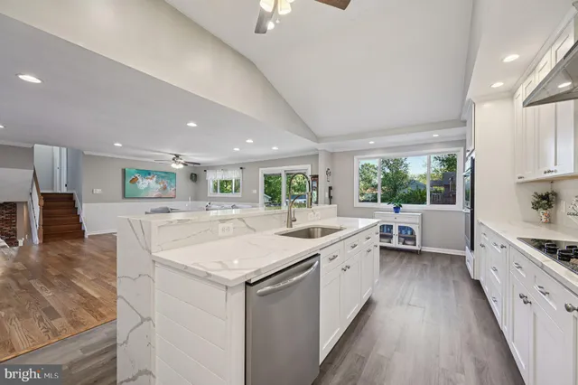 a kitchen with a sink stove and cabinets