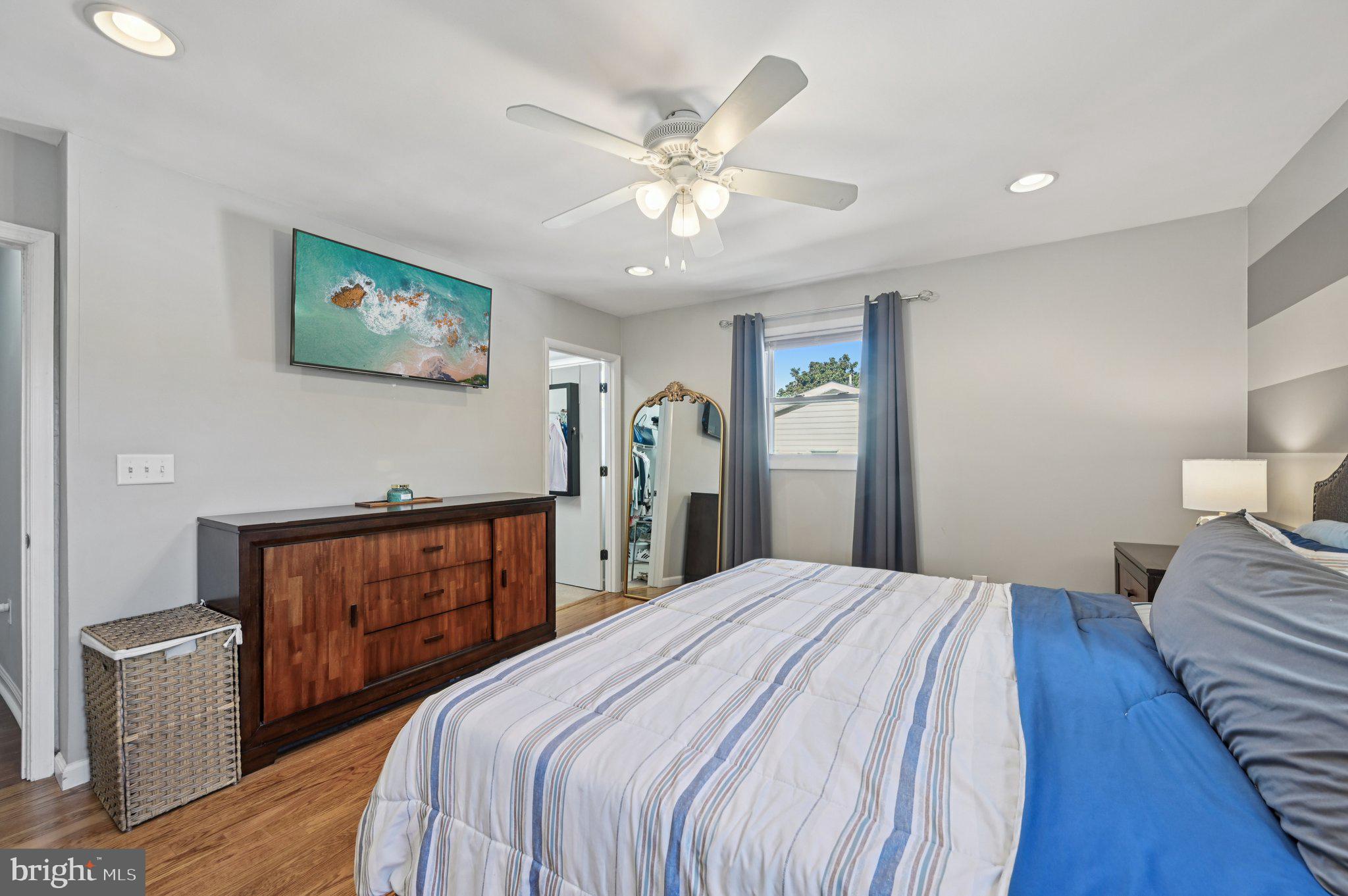 3025 Rock Drive Riva, MD 21140 - Photo 19 of 48 a bedroom with a large bed and a chandelier