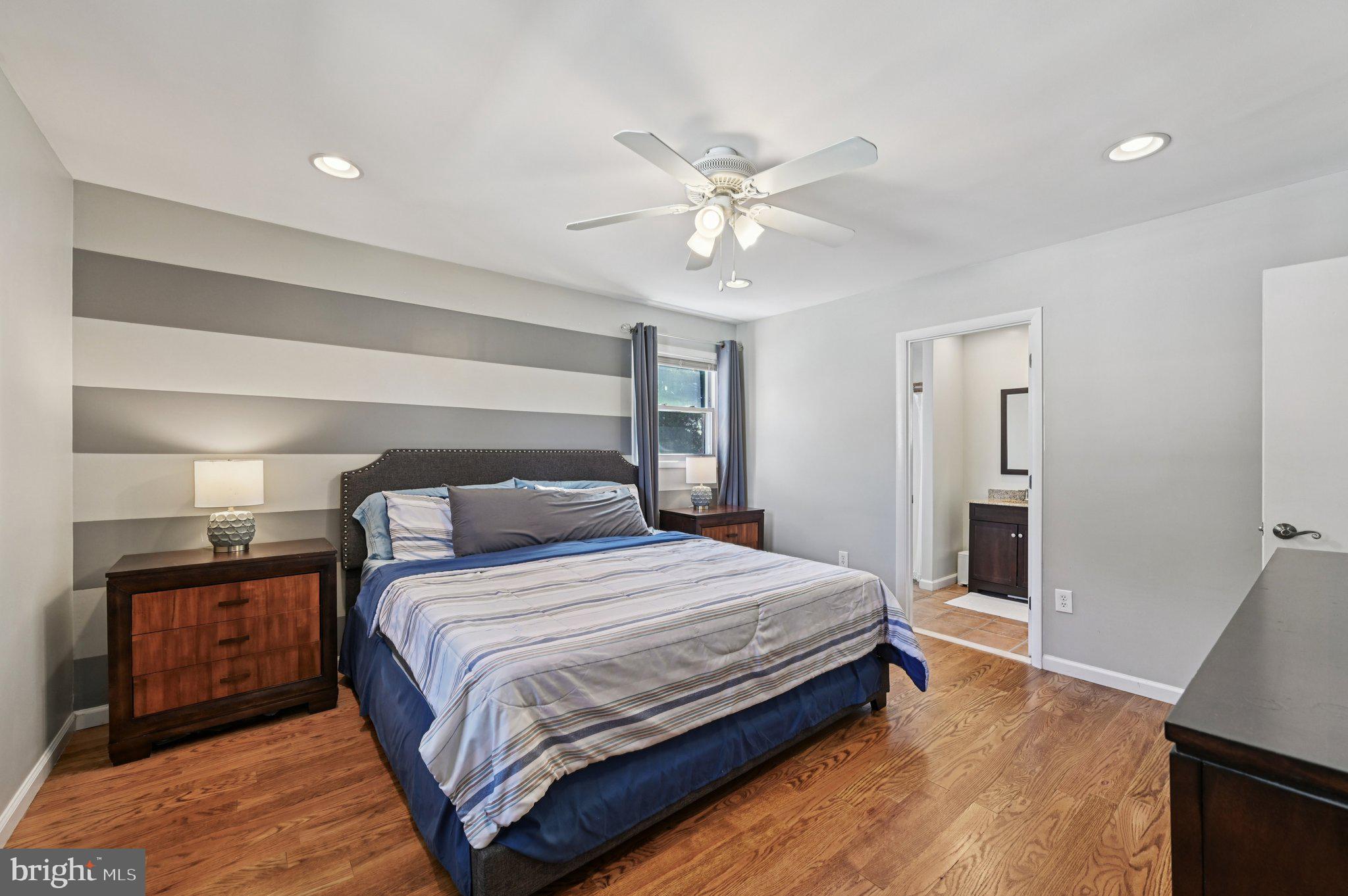 3025 Rock Drive Riva, MD 21140 - Photo 20 of 48 a bedroom with a bed and a chandelier