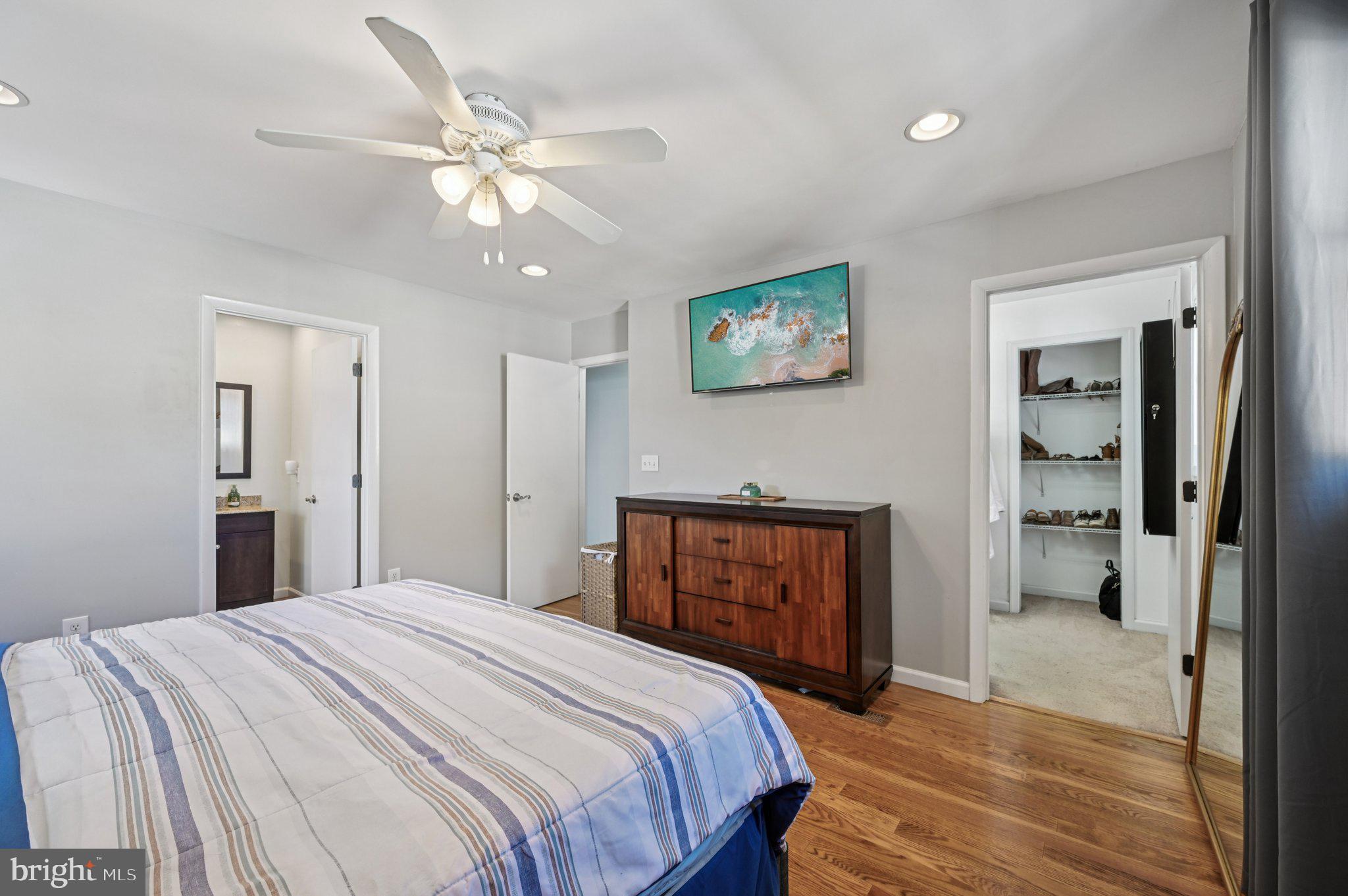 3025 Rock Drive Riva, MD 21140 - Photo 21 of 48 a bedroom with a bed and a chandelier