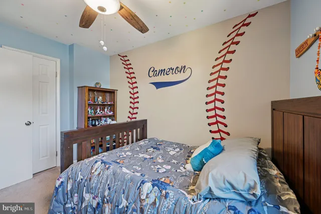 a bedroom with a bed and a book shelf