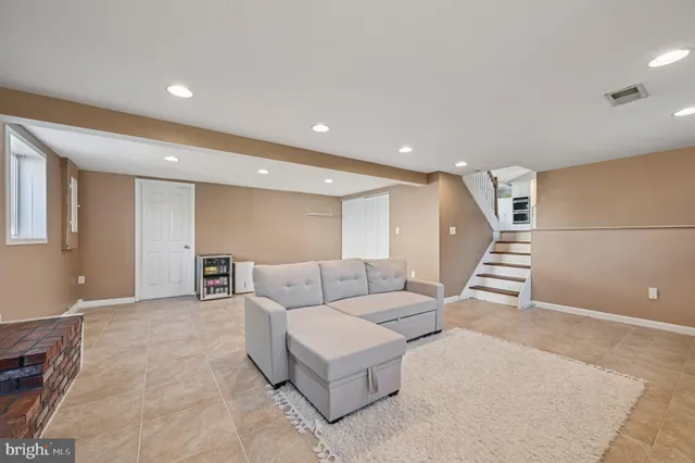 a living room with furniture and a rug