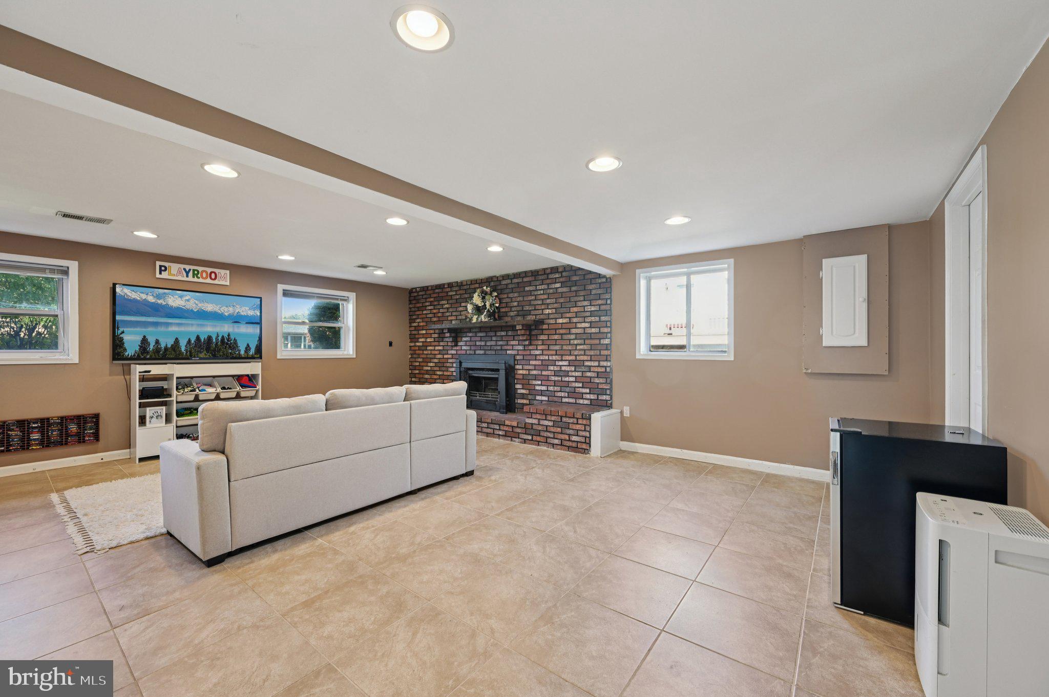 3025 Rock Drive Riva, MD 21140 - Photo 35 of 48 a living room with furniture and a flat screen tv