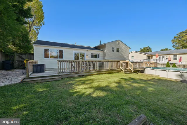 a view of a house with a yard porch and sitting area