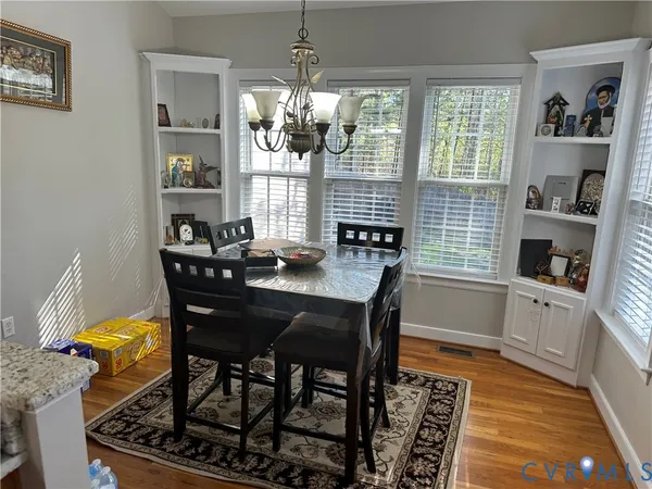 a dining room with furniture and window