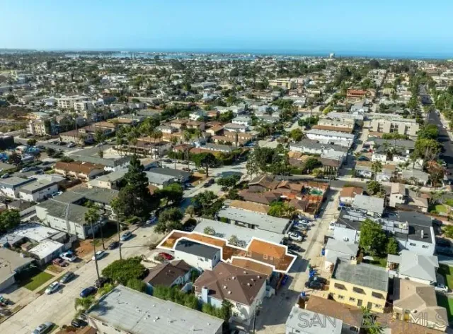 an aerial view of a city with lots of residential buildings
