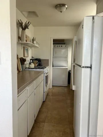 a kitchen with a sink and refrigerator