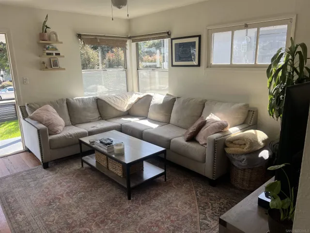 a living room with furniture and a window